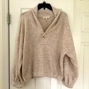 Super cute cream colored cropped sweater with a big collar. New with tags.